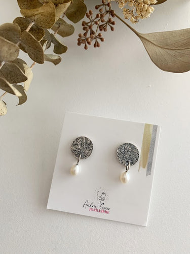 Boucles d'oreilles rondes avec perle en argent